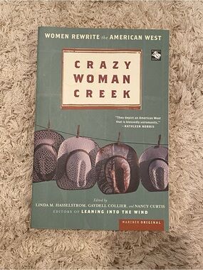 Crazy Woman Creek paperback book - teal cover with brown hats